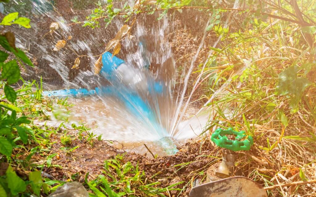 Water spraying out of a leaking pipe